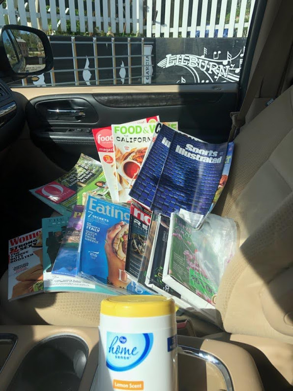 Judy drop off - car full of magazines and wetwipes